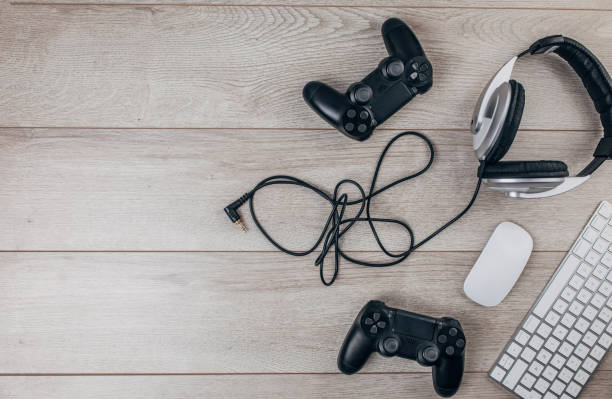Video gaming setup on wooden background stock photo