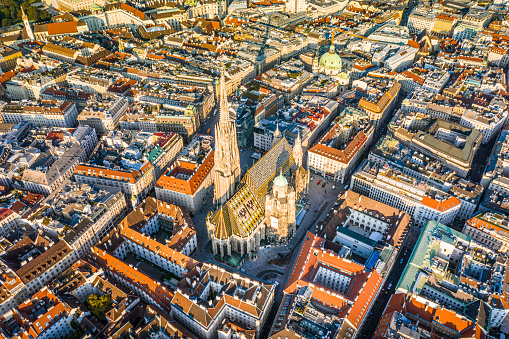 Vienna aerial view in Austria is one of the most famous capital cities of Europe. Flying by above Danube River, the historic city centre feat. old buildings around the downtown