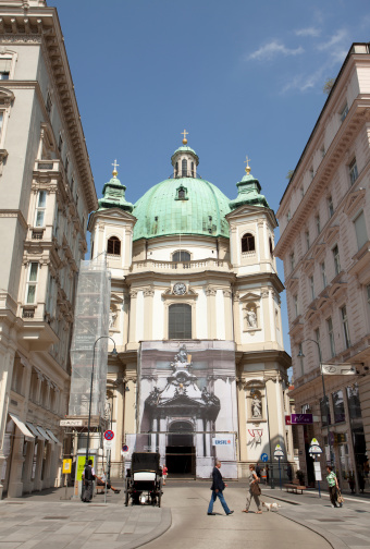 Vienna, Austria; July 20th 2010.Viena city street. peaceful sunny summer day with catholic church in background