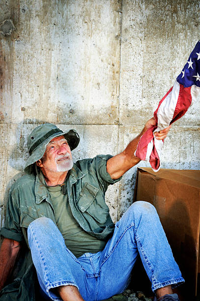 Vietnam Vet Getting a Hand Up with US Flag stock photo