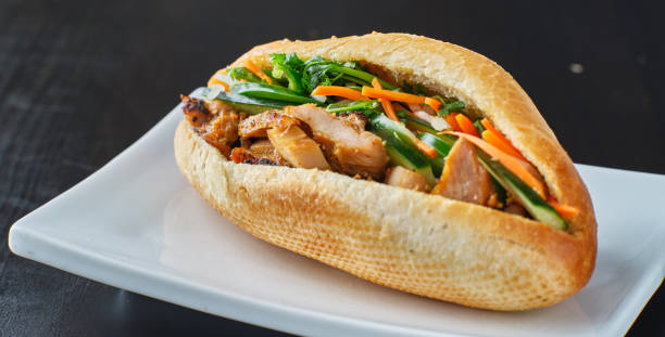 vietnamese bahn mi sandwich with pork belly stock photo