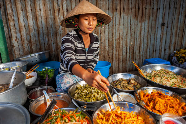 Vietnamese food vendor on local market stock photo