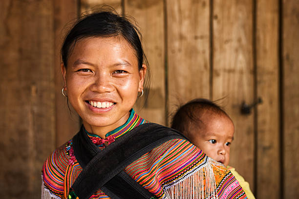 Vietnamese mother from Flower Hmong Tribe with her baby stock photo