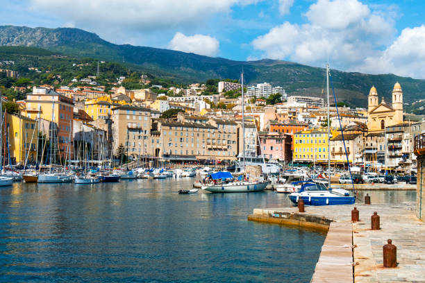 Vieux Port, the Old Port, in Bastia, France Bastia, France - September 16, 2018: A view of the Vieux Port, the Old Port of Bastia, in Corsica, France, highlighting the twin bell towers of the Saint-Jean-Baptiste church on the right bastia stock pictures, royalty-free photos & images