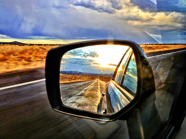 View ahead and view behind Window and mirror view on the road in the American Southwest. rear view mirror stock pictures, royalty-free photos & images