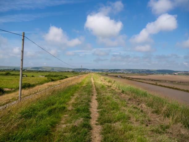 View along the South West Coastal Path near Horsey Island, Braunton Marsh, North Devon. View along the South West Coastal Path near Horsey Island, Braunton Marsh, North Devon. No people. braunton stock pictures, royalty-free photos & images
