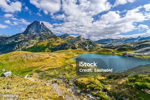 istock View at Midi Ossau mountain peak and Lake Roumassot, in Ayous-Bious valley in French Atlantic Pyrenees, as seen in October. Aquitaine, France. 1159176710