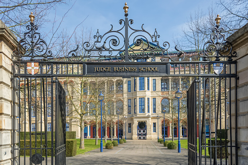 View At The Entrance Gate Of The Judge Business School Of Cambridge And  School Building On Background Stock Photo - Download Image Now - iStock