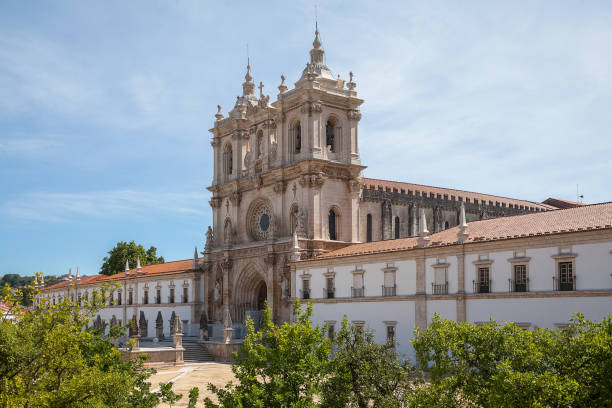 View at the facade of the Alcobaça Monastery (Mosteiro de Santa Maria de Alcobaça), a Catholic monastic complex, the church are Gothic, the towers are Baroque stock photo