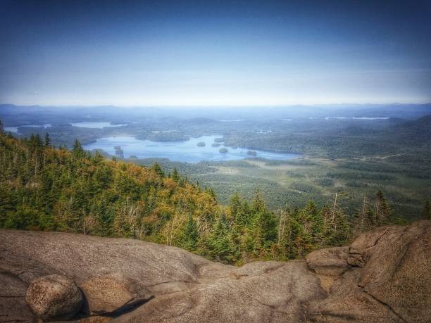 View from Ampersand Mountain, Adirondacks, New York State, Tupper Lake View from Ampersand Mountain, Adirondacks, New York State Vintage Style tupper lake stock pictures, royalty-free photos & images