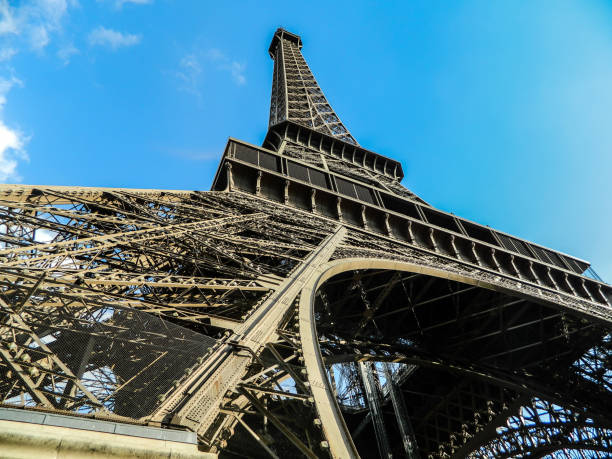 View from bottom of Eifell tower in Paris with clear blue sky stock photo