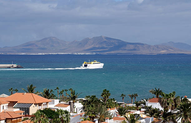 View from Corralejo to Lanzarote, ferry at sea stock photo