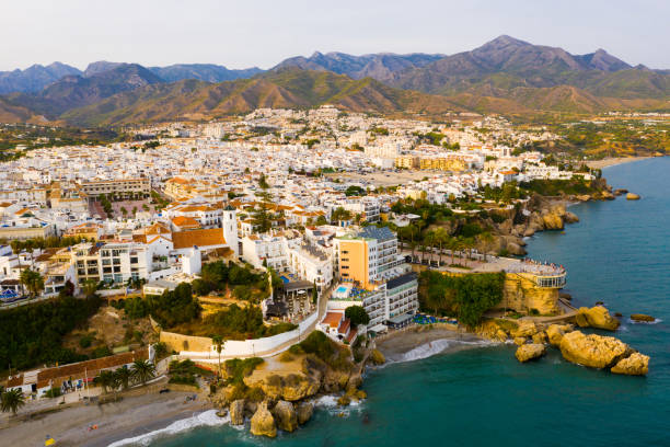 View from drone of coastal Mediterranean town of Nerja, Spain Picturesque summer view from drone of coastal Mediterranean town of Nerja, Axarquia, Andalusia, Spain nerja stock pictures, royalty-free photos & images