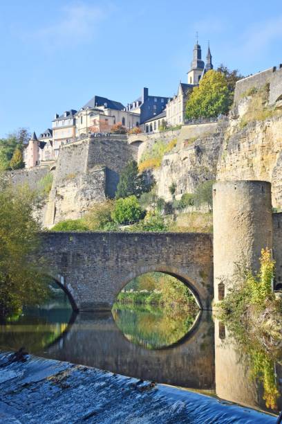 View from the Alzette river valley towards the casemates of Luxembourg City City scape of Luxembourg seen from Alzette valley luxembourg benelux stock pictures, royalty-free photos & images