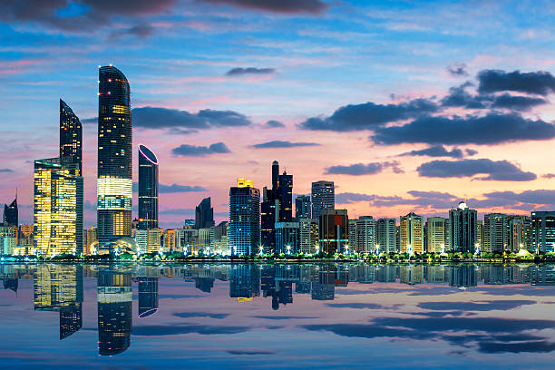 View of Abu Dhabi Skyline at sunset View of Abu Dhabi Skyline at sunset, United Arab Emirates abu dhabi stock pictures, royalty-free photos & images