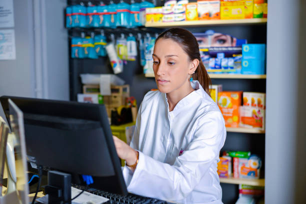 View of an attractive pharmacist at work stock photo