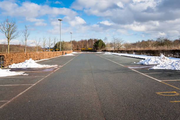 View of  an Empty Park Lot Cleared of Snow on a Sunny Winter Day stock photo