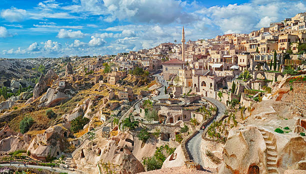 View of ancient Nevsehir cave town and  castle of Uchisar stock photo