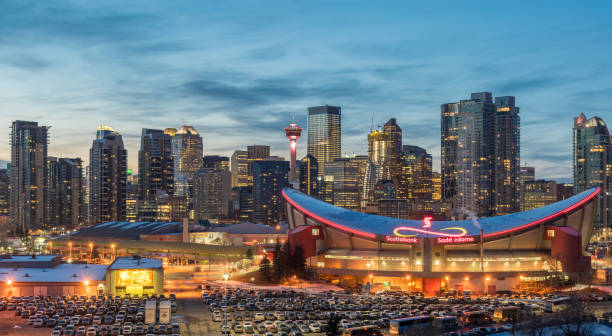 CALGARY, Canada - March 13. 2018: View of Calgaryskyline and Scotiabank Saddledome in the evening stock photo