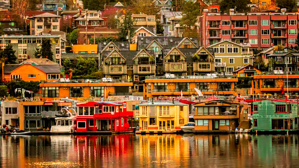 View of Colorful Homes from Across Lake Union Beautiful colors reflected in Lake Union during early morning sunrise. king county washington state stock pictures, royalty-free photos & images