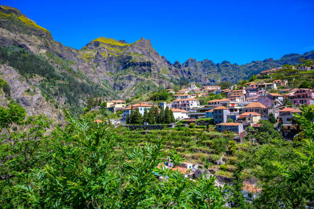 View of Curral das Freiras village in the Nuns Valley in beautiful mountain scenery, municipality of Câmara de Lobos, Madeira island, Portugal. View of Curral das Freiras village in the Nuns Valley in beautiful mountain scenery, municipality of Câmara de Lobos, Madeira island, Portugal. barcelos stock pictures, royalty-free photos & images
