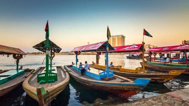 View of Dubai Creek. Boats and Abra ferries on the Bay of Creek in Dubai. Famous tourist destination in the UAE. stock photo