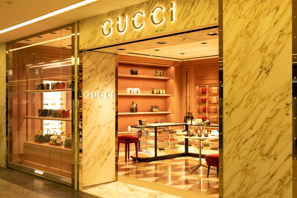View of  Gucci front store, an Italian luxury brand of fashion and leather goods, at Narita International Airport, Chiba, Japan. Chiba, Japan - March 24, 2019: View of  Gucci front store, an Italian luxury brand of fashion and leather goods, at Narita International Airport, Chiba, Japan. gucci stock pictures, royalty-free photos & images