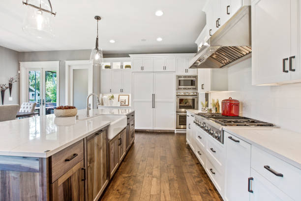 view of kitchen galley with hardwood flooring - kitchen imagens e fotografias de stock