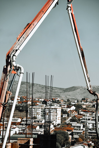 View Of Kocani, Macedonia Through Construction Rods And Crane On Building Construction Site