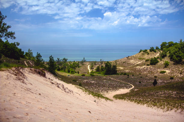 View of Lake Michigan over the dunes at Indiana Dunes National Park View of Lake Michigan over the dunes at Indiana Dunes National Park sand dune stock pictures, royalty-free photos & images