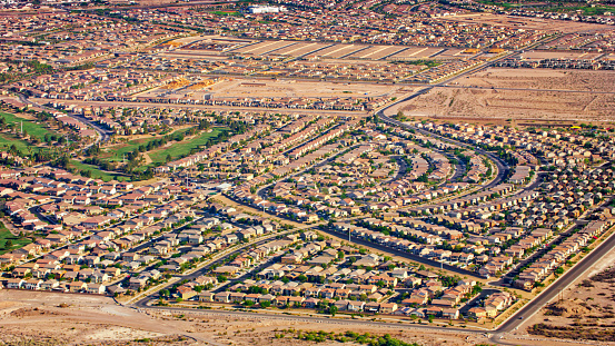 Aerial view of neighbourhood of tract housing in sunny day, Nevada, USA.