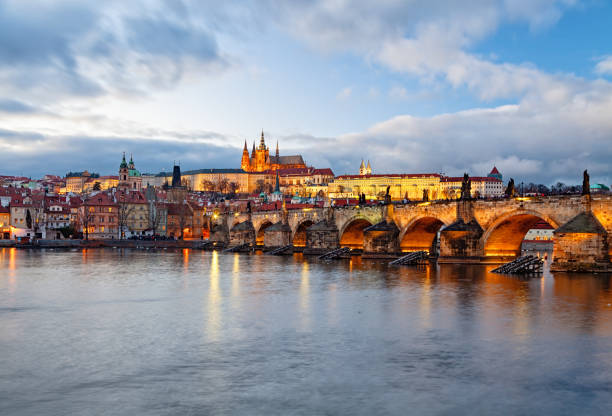 View of Prague and Charles Bridge over Vltava river at sunset View of Prague at winter vltava river stock pictures, royalty-free photos & images