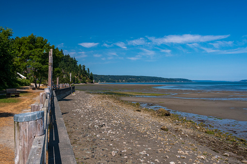 Langley, Washington is located on the coast of Whidbey Island.  The island is in the Puget Sound.  This image was captured on the shore just below the town in the summer.