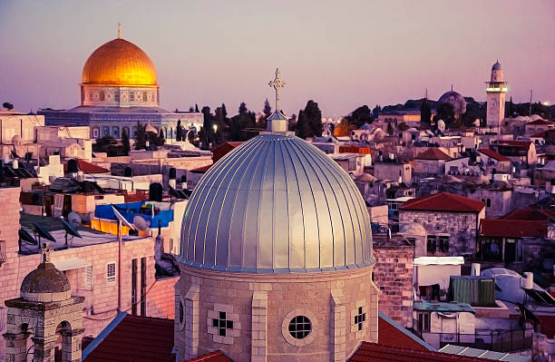View of rooftops of Old City of Jerusalem at sunset. stock photo