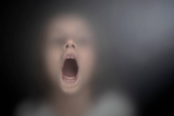 View of scared child through frosted glass  ghost boy stock pictures, royalty-free photos & images