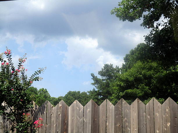 View of Sky from Backyard Fence stock photo