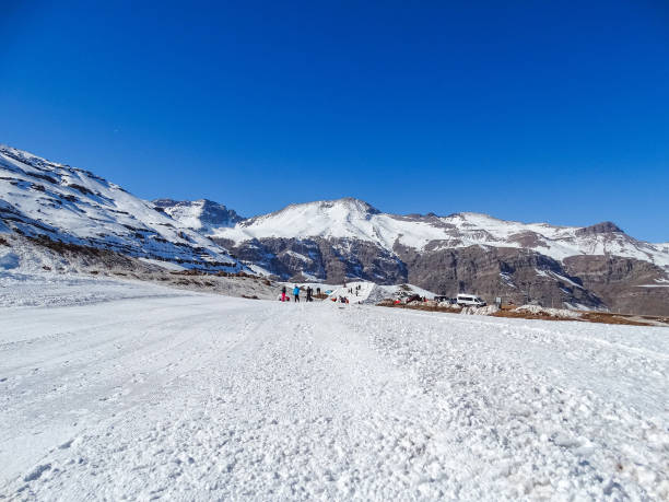 View of snowy hill for skiing on a sunny day of blue sky stock photo
