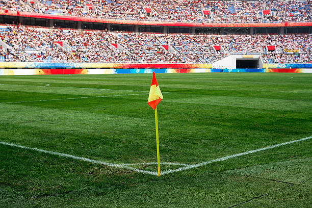 View of soccer corner flag on empty field stock photo