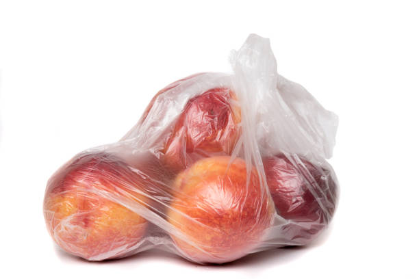 View of some peaches inside a plastic bag. stock photo