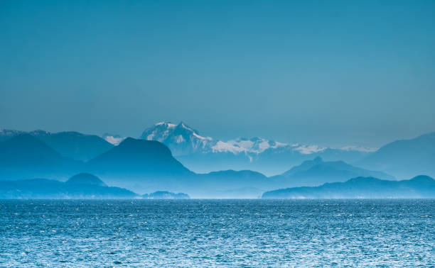 View of the Coast Mountains of continental British Columbia from Vancouver Island, north of Nanaimo. Canada stock photo