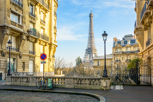 View of the Eiffel Tower from a small cobbled dead-end street of the Chaillot hill by a sunny winter afternoon