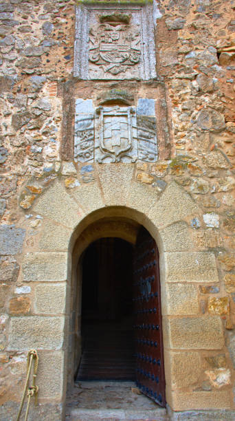View of the entrance of the tower of the medieval castle of the city of Consuegra. Route of Don Quixote. stock photo
