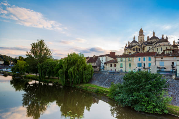 View of the Isle river and the Saint Front cathedral in Perigueux from the bridge des Barris, Dordogne Department, Nouvelle Aquitaine region. France. stock photo