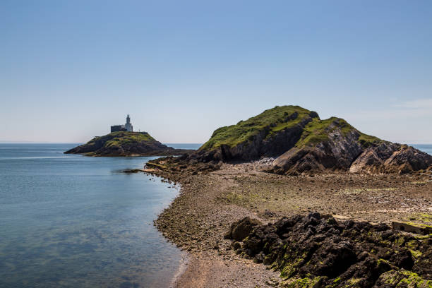 A View of the Lighthouse and Headland at Mumbles, South Wales stock photo