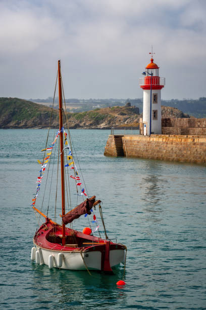View of the picturesque harbor and lighthouse of Erquy, Côtes d'Armor, Brittany, France stock photo