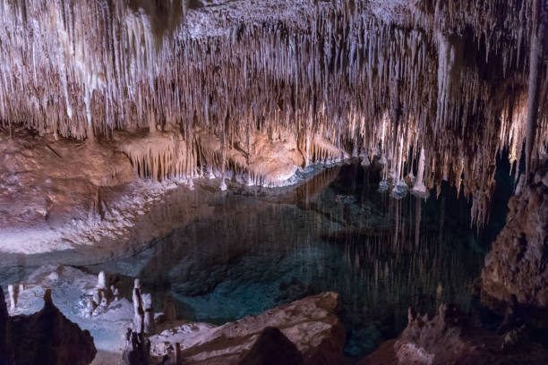 view of the stalactites and stalagmites in the cave image of the stalactites and stalagmites in the cave grotto cave stock pictures, royalty-free photos & images