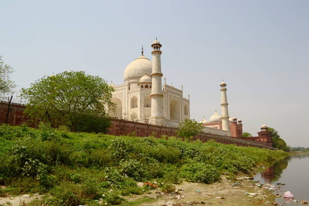 View of the Taj Mahal mosque from a riverside stock photo