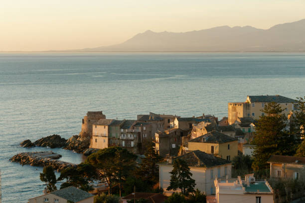 View of  the village of Erbalunga at sunrise, Cap Corse in Corsica, France View of  the village of Erbalunga at sunrise, Cap Corse in Corsica, France bastia stock pictures, royalty-free photos & images