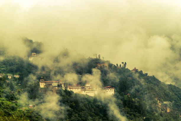 View of Trongsa Dzong with foggy hills, Bumthang, Bhutan, Asia. stock photo
