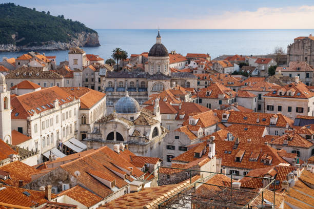View over the roofs of old town Dubrovnik with church towers, ocean and island, Croatia stock photo